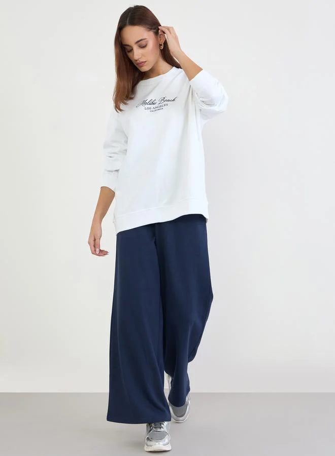 Styli Styli Printed Longline Sweatshirt and Wide Leg Joggers Co-Ords