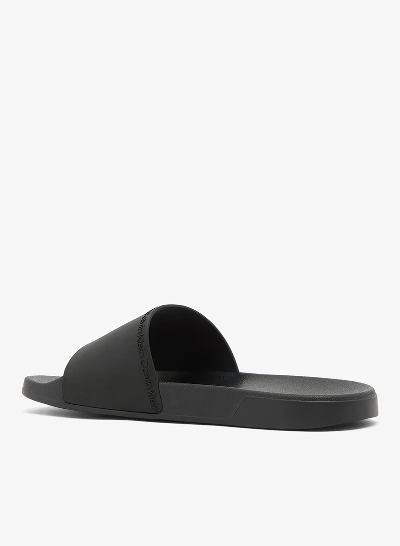 Calvin Klein Triple Black Essential Repeat Logo Pool Slides for Men | Best Price UAE