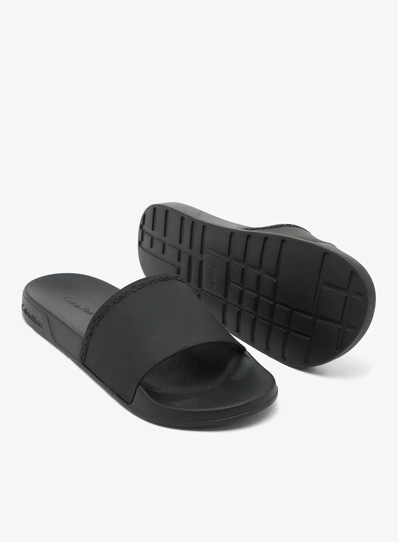 Calvin Klein Triple Black Essential Repeat Logo Pool Slides for Men | Best Price UAE