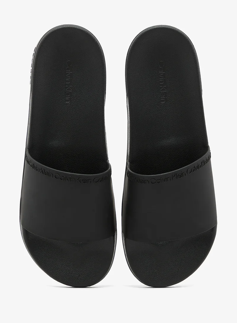 Calvin Klein Triple Black Essential Repeat Logo Pool Slides for Men | Best Price UAE