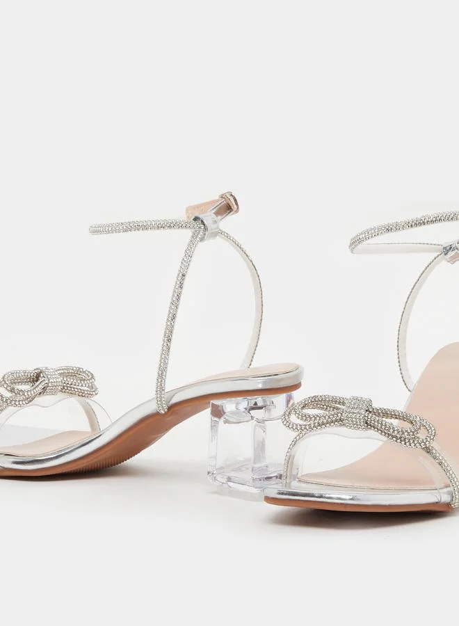 Take Two Embellished Bow Transparent Block Heel Sandals by Styli