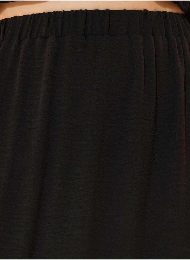 Take Two Solid Ruffled Detail Asymmetrical Hem Maxi Skirt