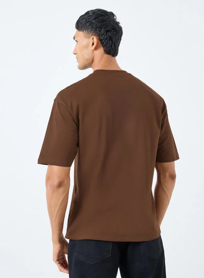 Styli Styli Men Brown Oversized Flock Chest Print T-Shirt