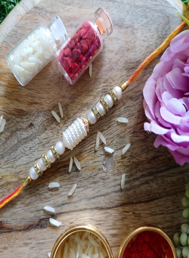 PICRAZEE Raksha Bandhan Gift Combo for Brother - Rakhi, Roli-Chawal Bottles, Leather Wallet, Fridge Magnet & Greeting Card - Image 3