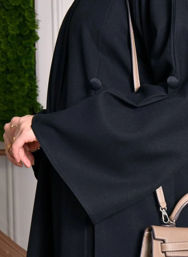 HAWRAA ABAYA Black abaya with pleats and buttons on the sleeves, front and back
