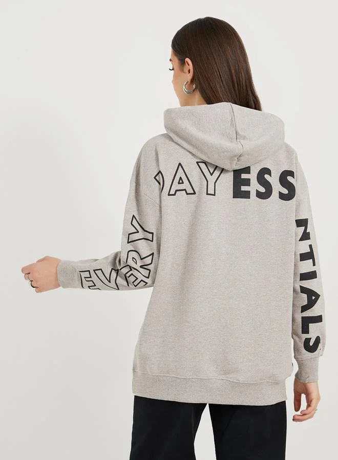 Styli Oversized Longline Dropped Shoulder Hoodie with Back Print