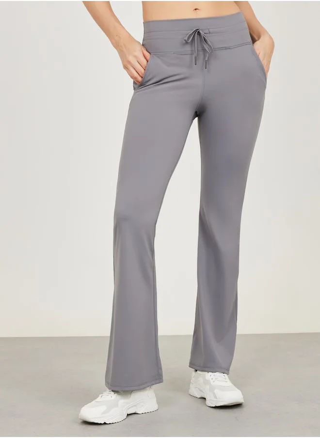 ستايلي Wide Drawcord Waistband Flared Legging with Pocket