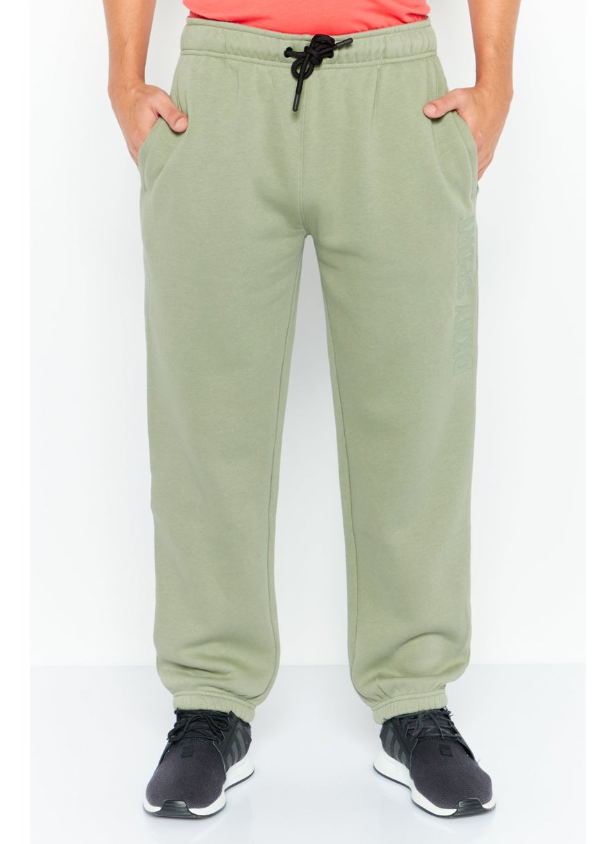 DKNY Sport Men Sportswear Fit Drawstring Training Sweatpants, Sage  - Image 1