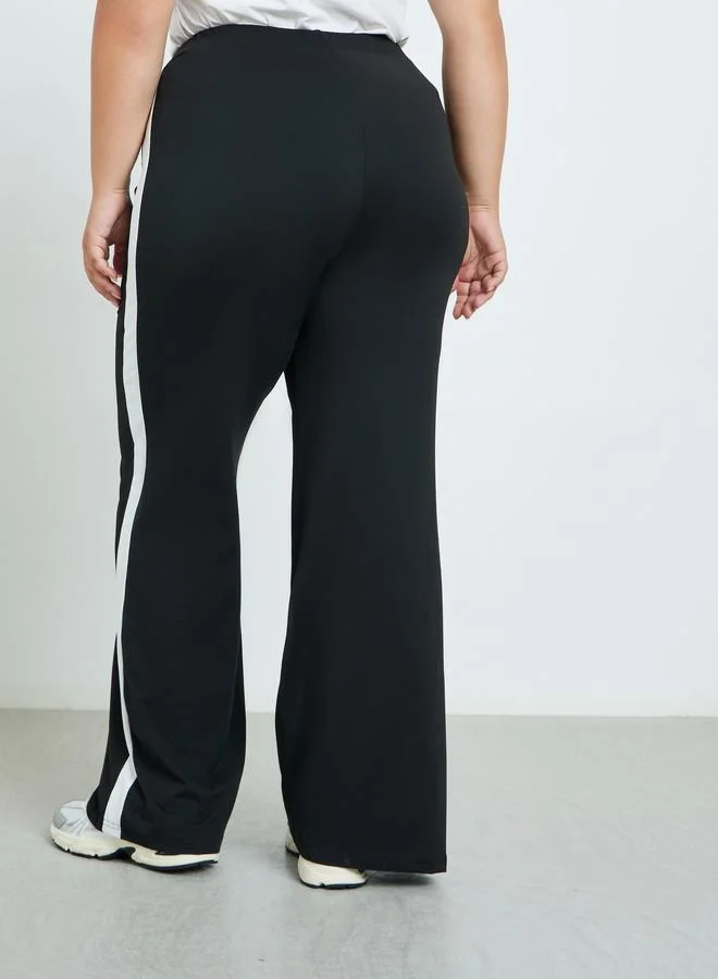 Styli Plus Size Side Stripe Flared Leggings