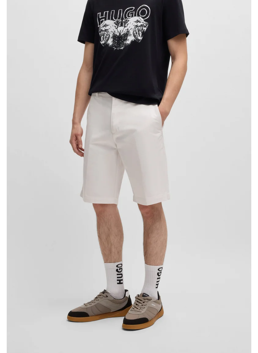 HUGO Regular-fit shorts with slim leg and buttoned pockets