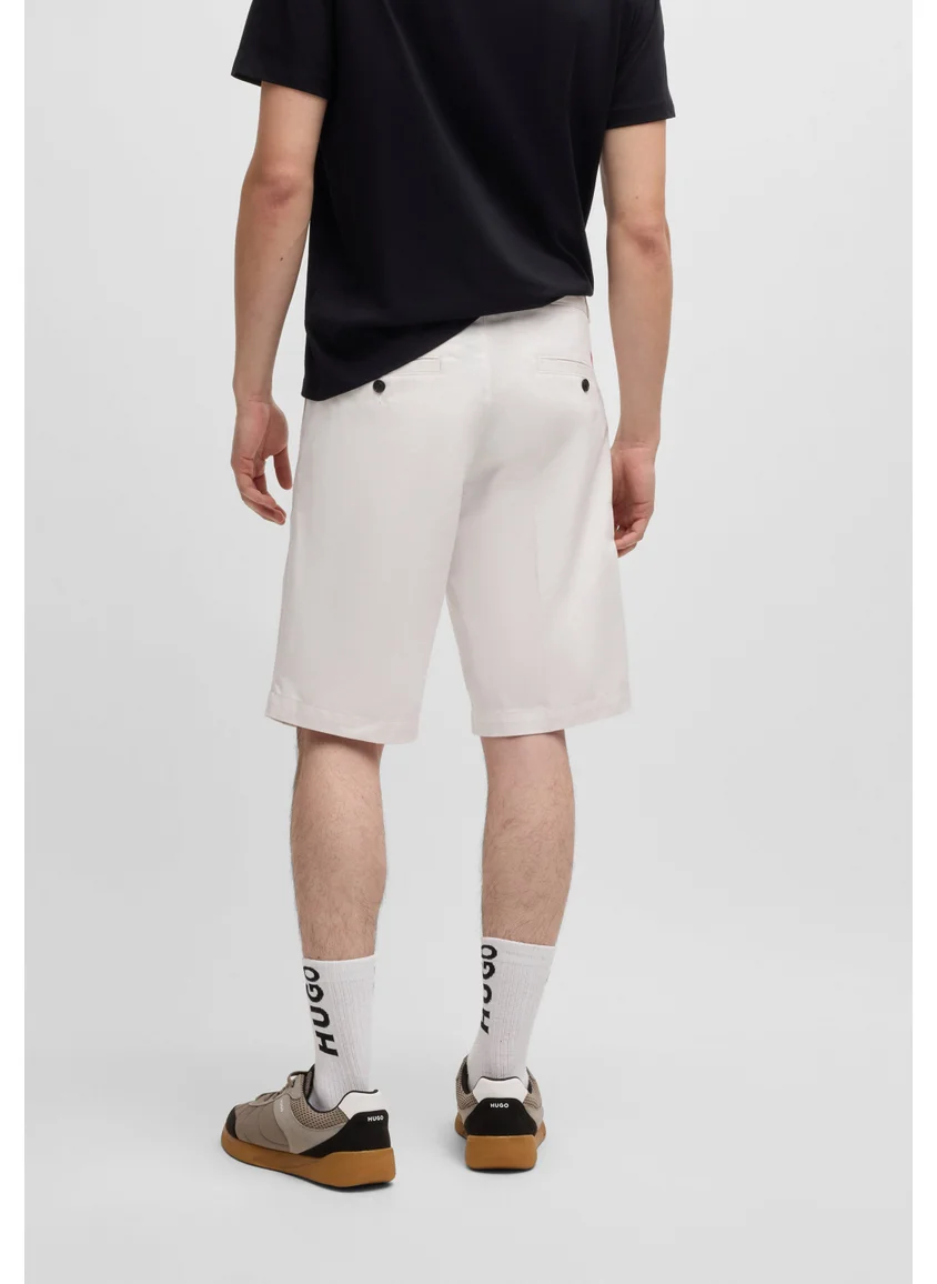 HUGO Regular-fit shorts with slim leg and buttoned pockets