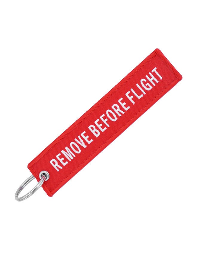 سلسلة مفاتيح بتصميم مطرز بعبارة "Remove Before Flight"