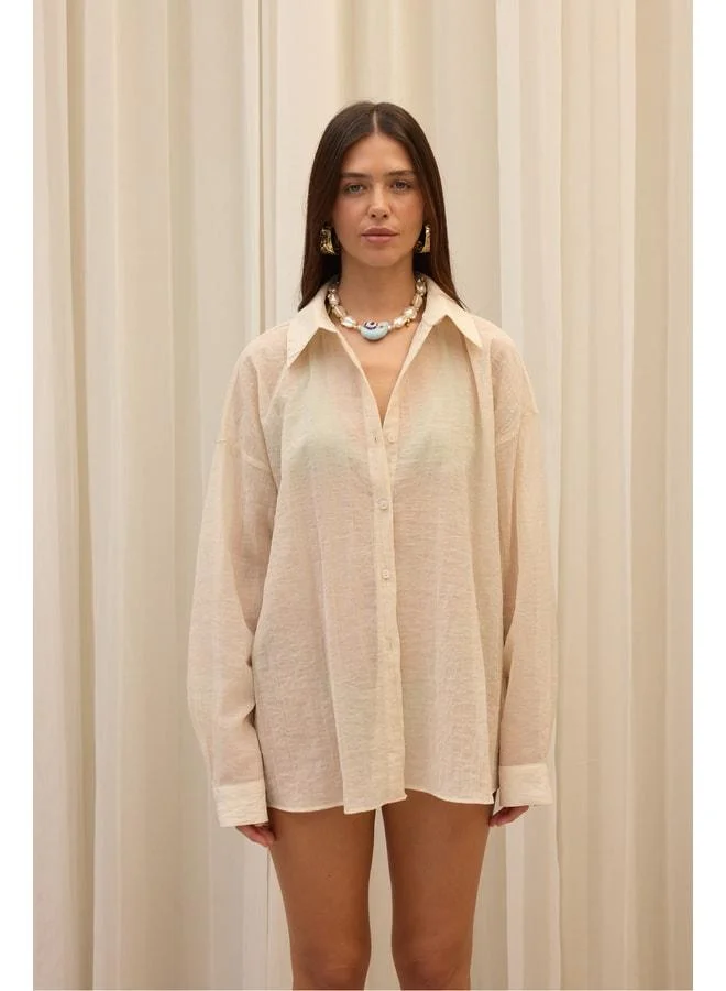 Bohemai Syaritta Oversize Beige Transparent Shirt.