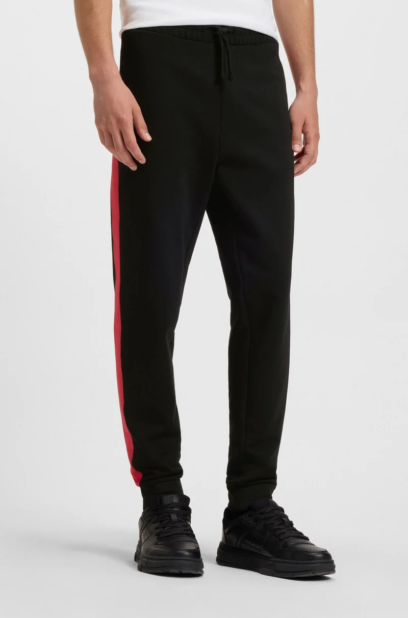 HUGO Cotton-terry tracksuit bottoms with contrast side stripes