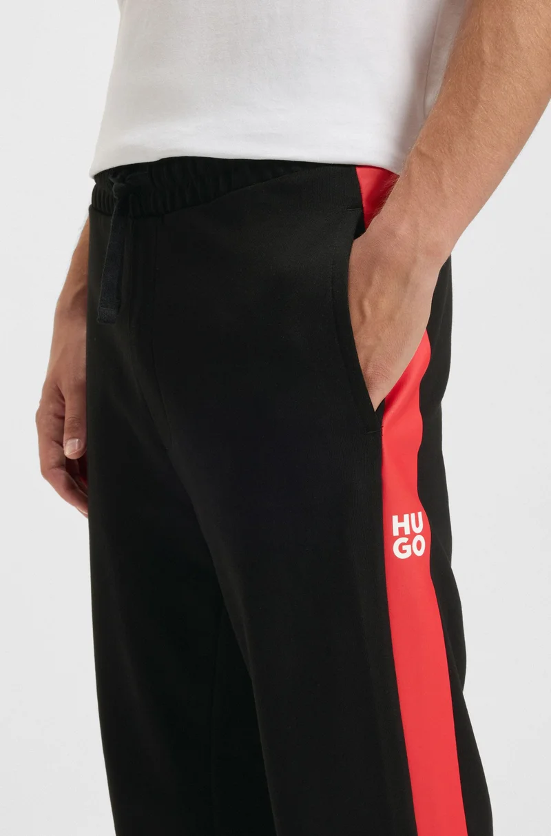 HUGO Cotton-terry tracksuit bottoms with contrast side stripes