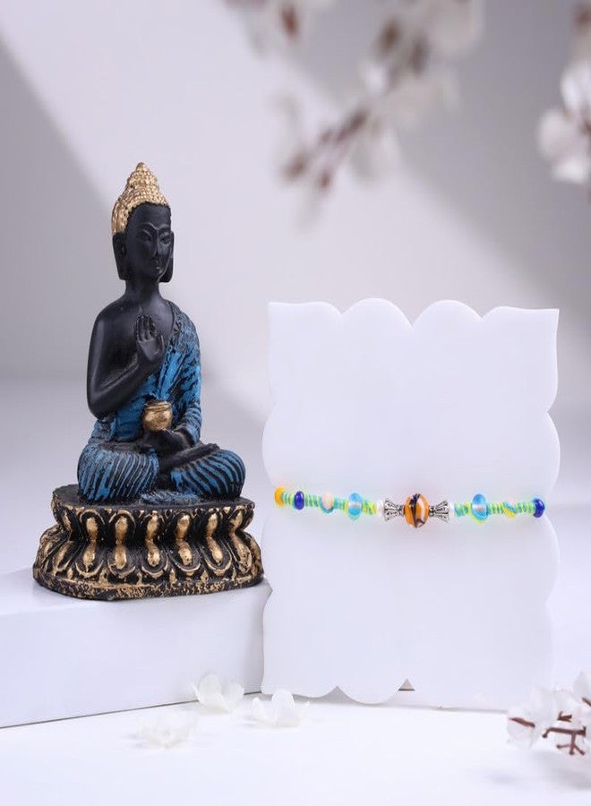 Floweraura Raksha Bandhan Celebration Premium Handcrafted Vibrant Marbles Twisted Bead Rakhi with Lord Buddha Idol Showpiece - Rakhi for Brother, Bhai, Cousins & Raksha Bandhan Gift - Image 1