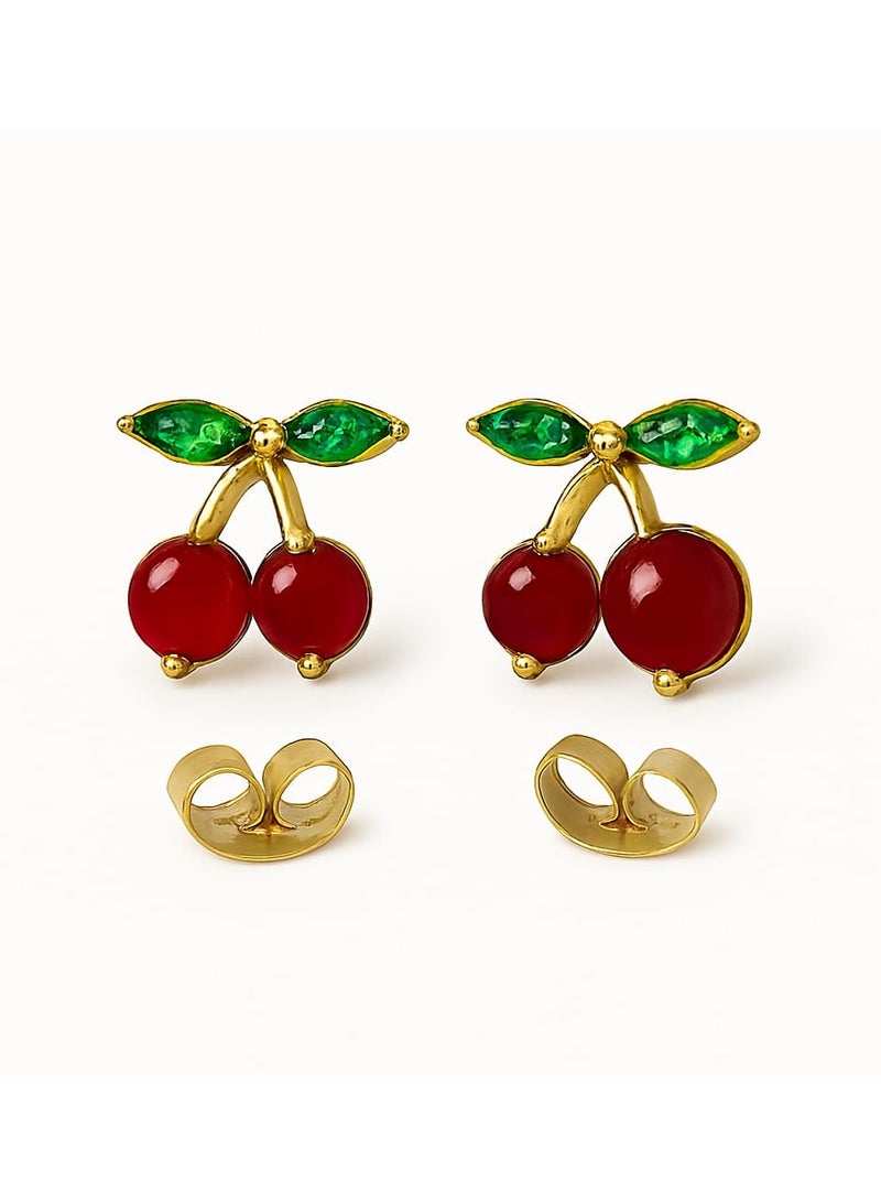 "A playful, feminine touch - made of stainless steel. Add a fresh, playful touch to your look with this cherry earring. Its unique design combines two rich red beads with an elegant gold stem, punctuated by tiny green leaves, adding a charming, natural touch. Perfect for those who love subtle details and unconventional, distinctive looks." - Image 1