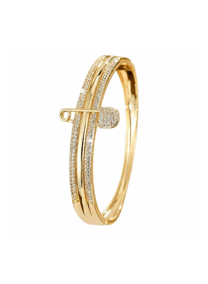 veya Gold-tone women's bracelet featuring a safety pin design embellished with sparkling stones – a stylish accessory for everyday looks and special occasions. - Image 1
