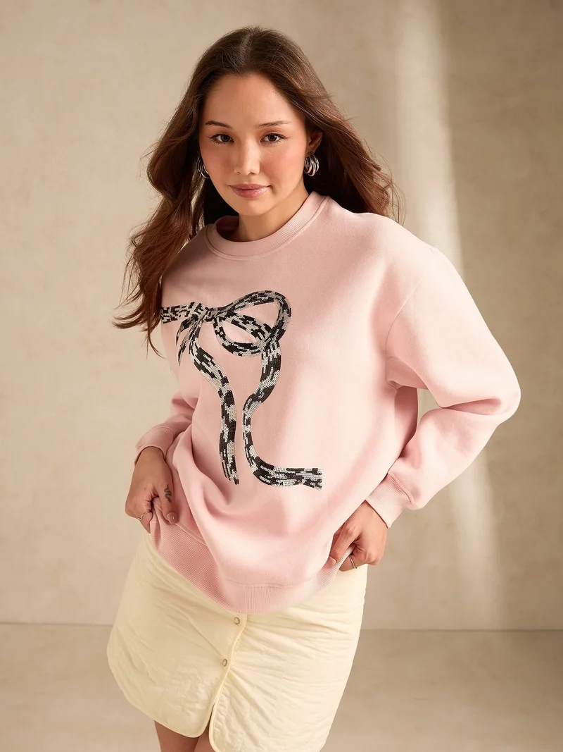 Outzidr  Pink Sequined Bow-Detail Russian Fleece Sweatshirt for Women | Best Price UAE