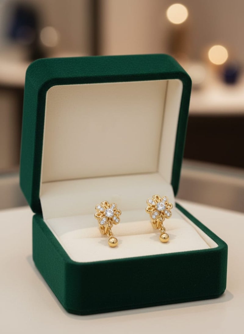 A delicate gold-plated earring featuring a sparkling flower design with dazzling stones that add elegance and radiance, completed with a small gold ball-shaped pendant. - Image 5