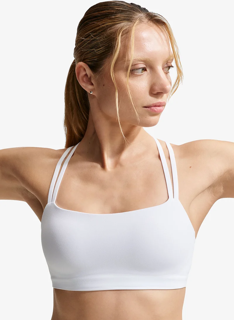 Nike WHITE/(COOL GREY) Dri-FIT Zenvy Strappy Bra for Women | Best Price UAE