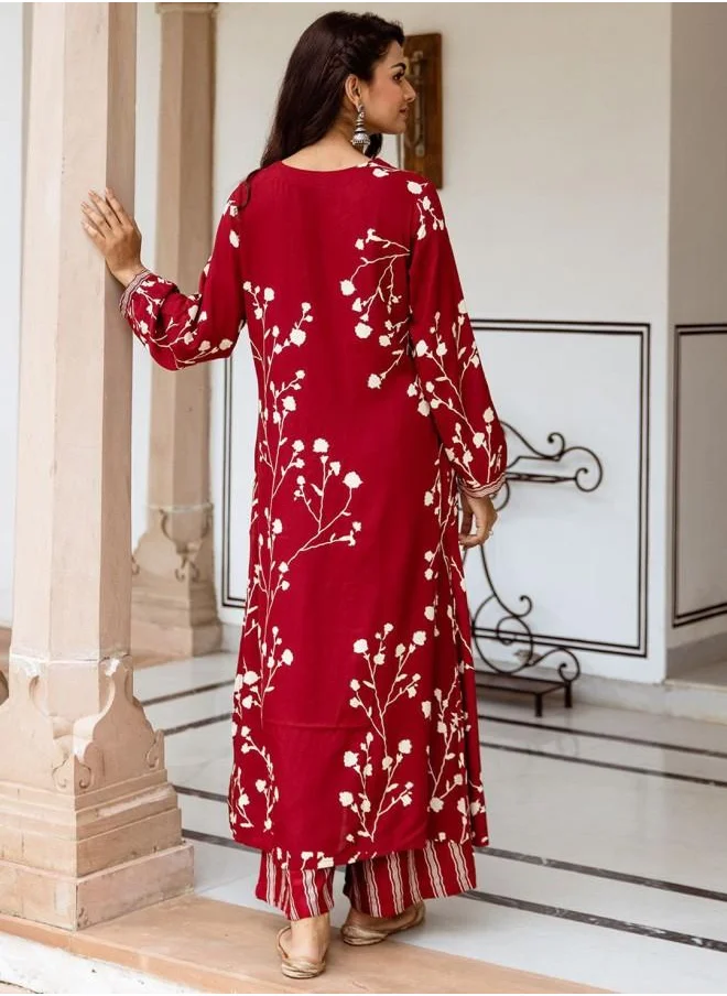 ISHIN Rayon Women Red Rayon Kurta Set with Embroidered pattern Tunic and Palazzo features a Round neckline and Three-Fourth Sleeve secured with Elastic closure and styled in Straight Fit ideal for Festive moments — a must-have for your statement wardrobe.