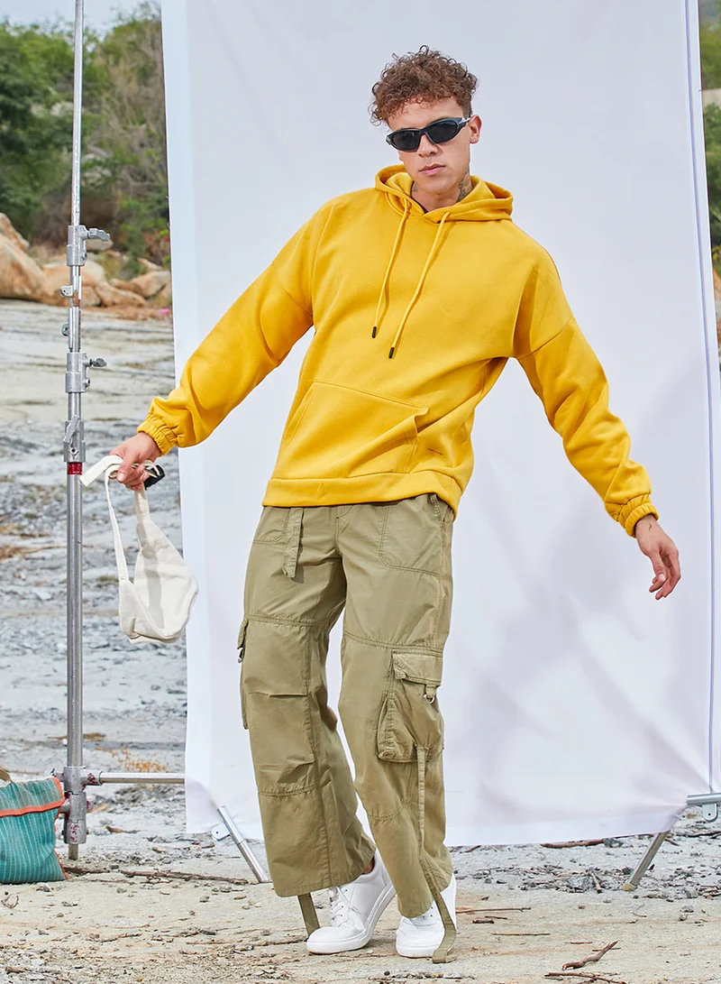 Campus Sutra Men's Mustard Yellow Oversized Pullover Sweatshirt With Kangaroo Pocket