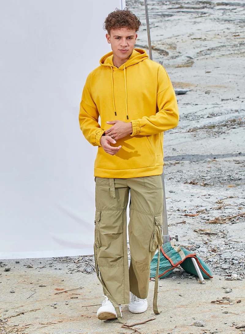 Campus Sutra Men's Mustard Yellow Oversized Pullover Sweatshirt With Kangaroo Pocket