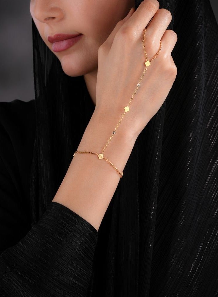 Guy Laroche سوار يد مطلي بالذهب لوري مع شعار وكريستالات للنساء - Image 1