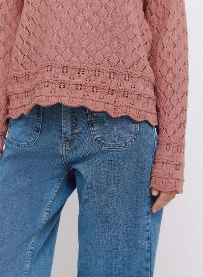 Springfield  Voluminous long sleeve jumper. Round neck. Pointelle knit with openwork details. Ribbed neck. Wavy hem and cuffs. This garment is made with sustainable cotton. for Women | Best Price UAE