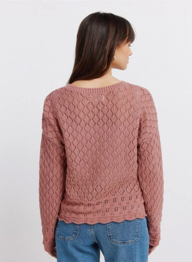 Springfield  Voluminous long sleeve jumper. Round neck. Pointelle knit with openwork details. Ribbed neck. Wavy hem and cuffs. This garment is made with sustainable cotton. for Women | Best Price UAE