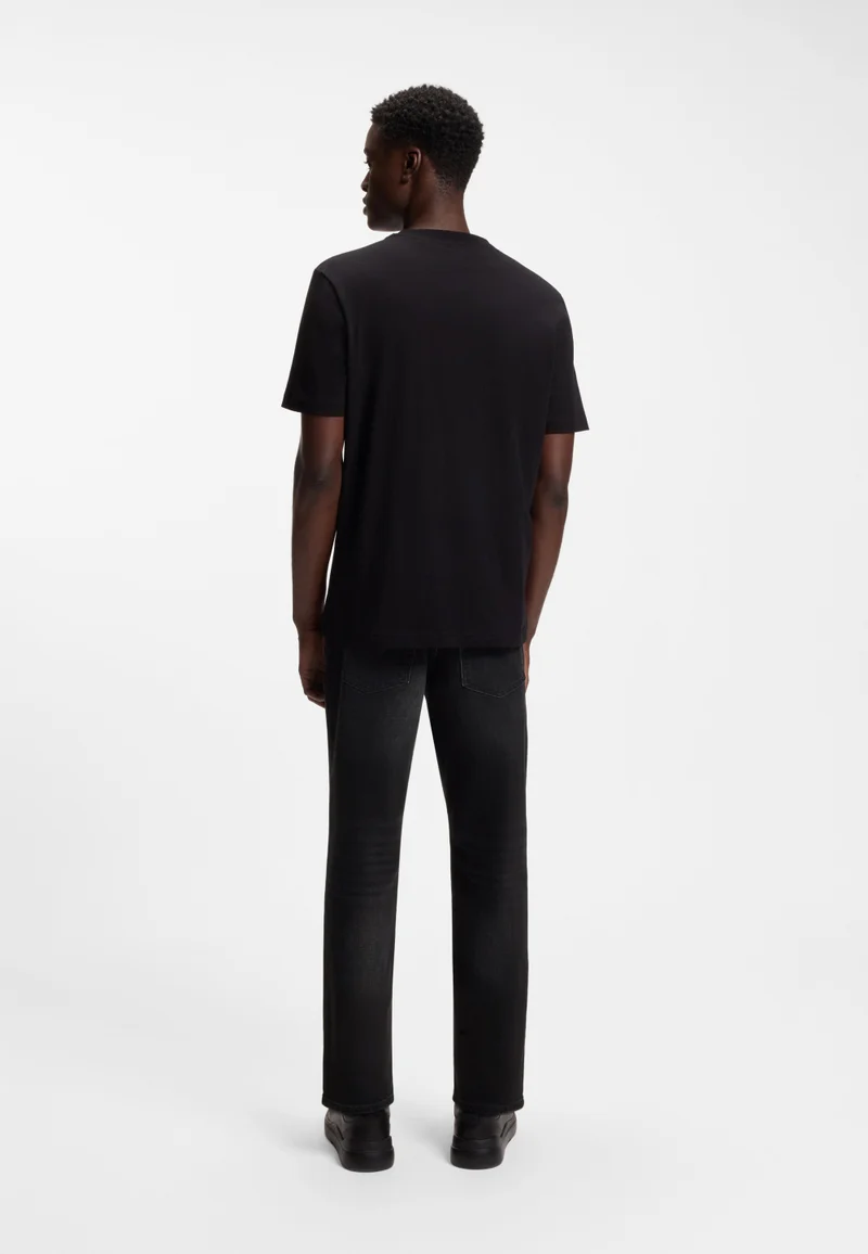 هوجو جينز بقصة مدببة من قماش الدينم الأسود المطاطي