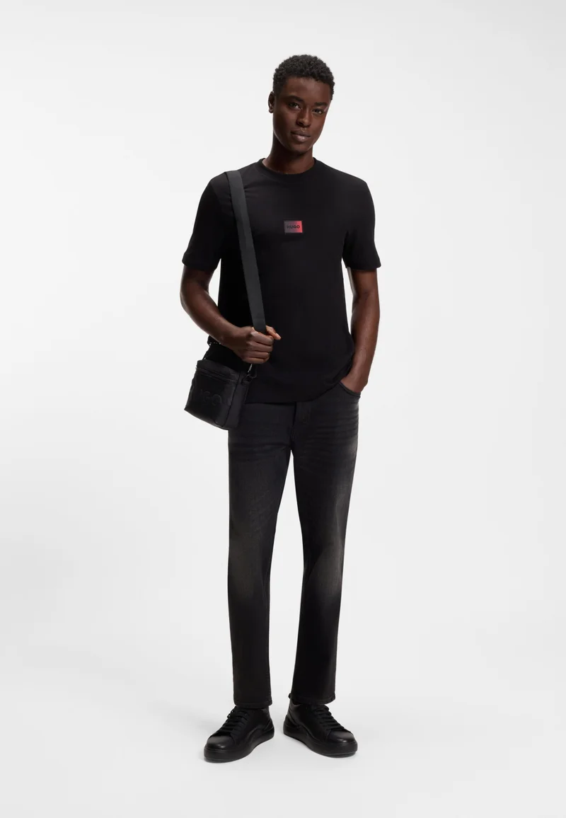 HUGO Black Tapered-fit jeans in black stretch denim for Men | Best Price UAE