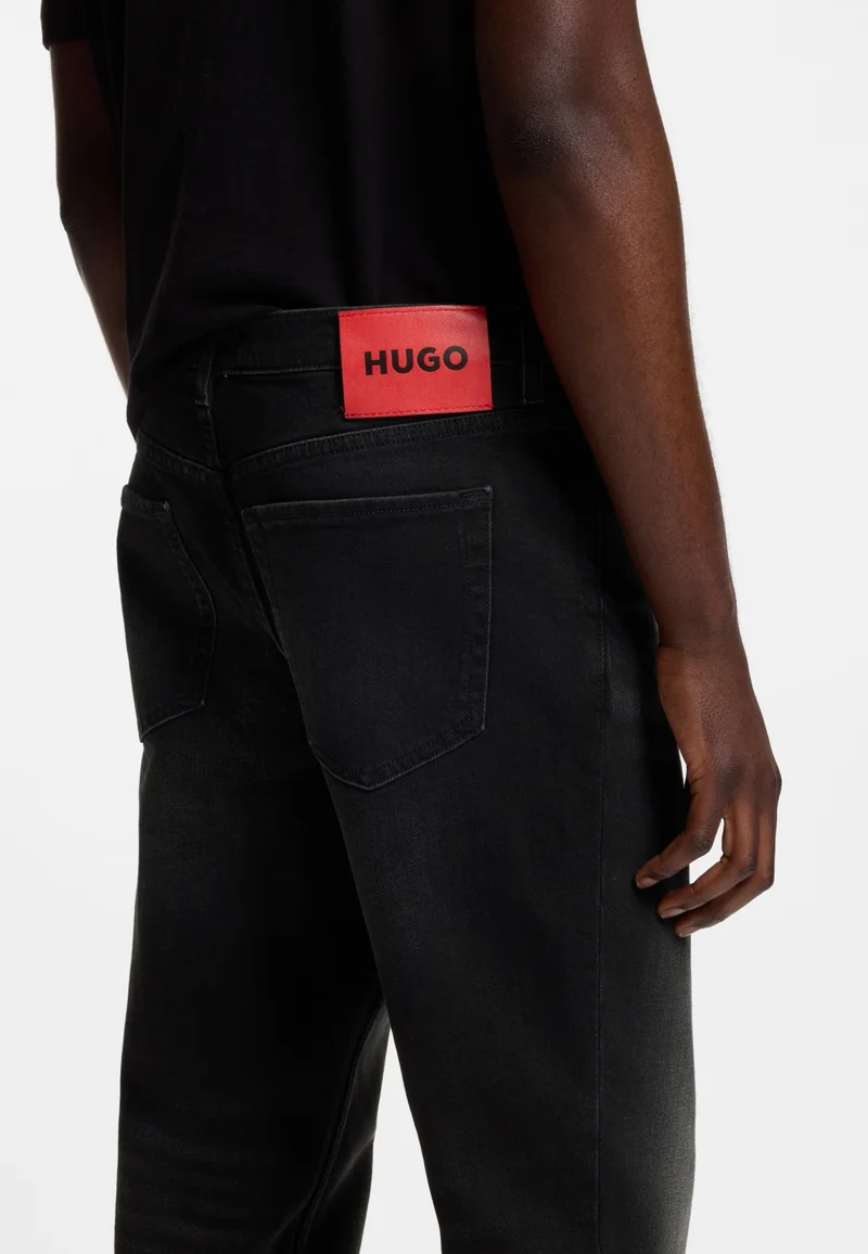 HUGO Black Tapered-fit jeans in black stretch denim for Men | Best Price UAE