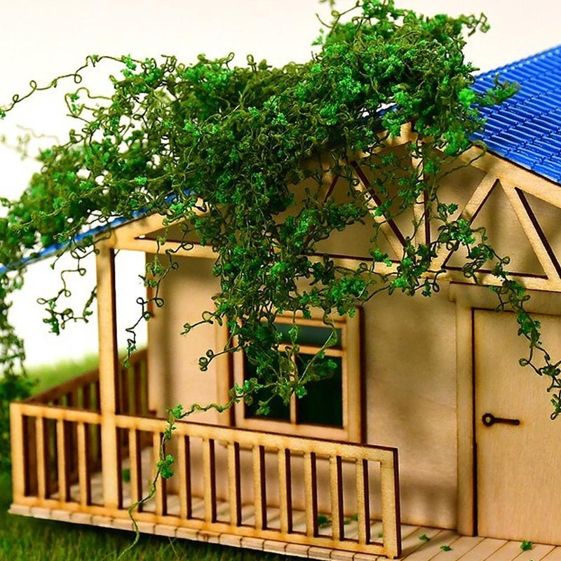Miniature simulated landscape of climbing vines, ivy, leaves, wall models, cotton thread, multi-colored roof, moss, and green plants - Image 3