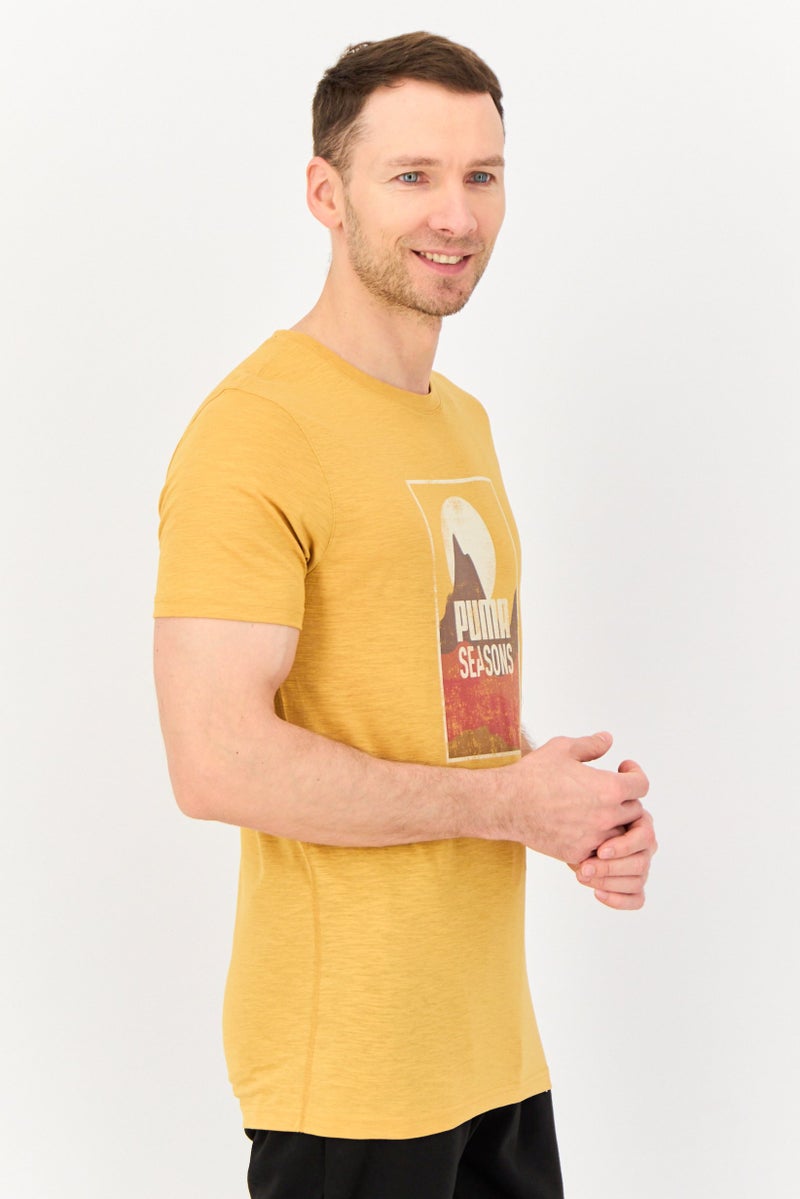 PUMA Men Sportswear Fit Short Sleeve Graphic Print Outdoor T-Shirt, Mustard - Image 4