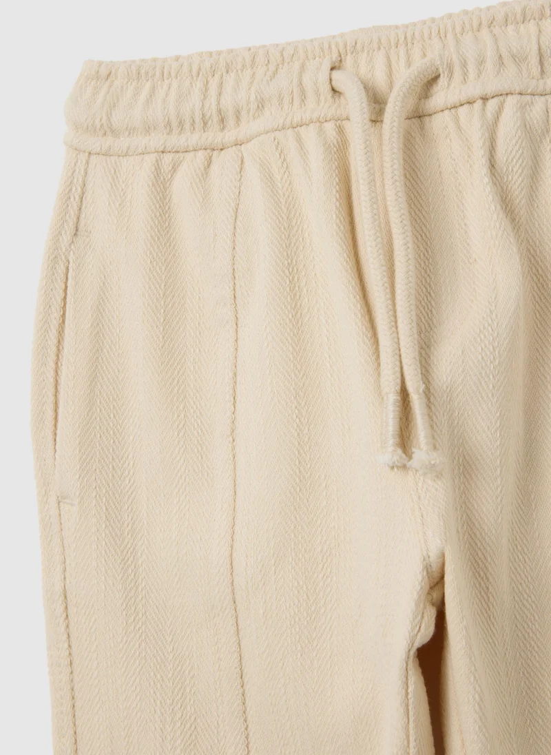 او في اس CHILDREN'S TROUSERS IN BEIGE COTTON BLEND OVER
