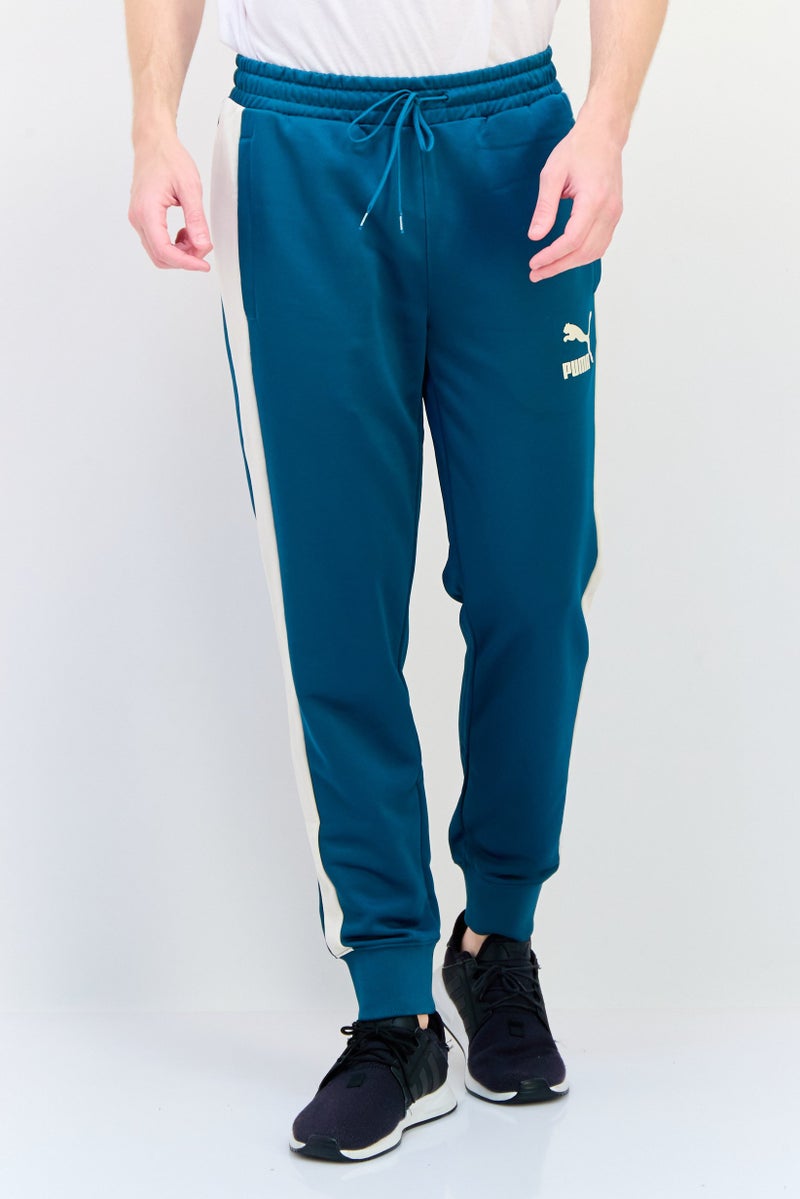 PUMA Men Slim Fit Brand Logo Outdoor Sweatpants, Green  - Image 1