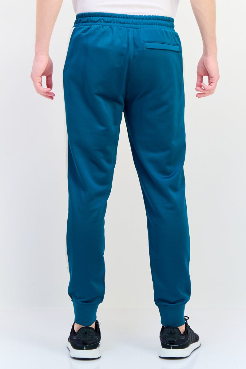 PUMA Men Slim Fit Brand Logo Outdoor Sweatpants, Green  - Image 3