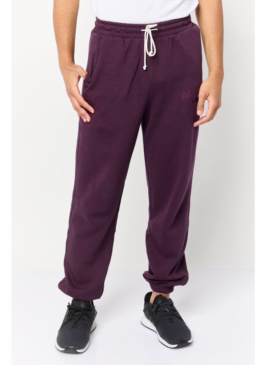PUMA Men Relaxed Fit Outdoor Sweatpants, Purple  - Image 1