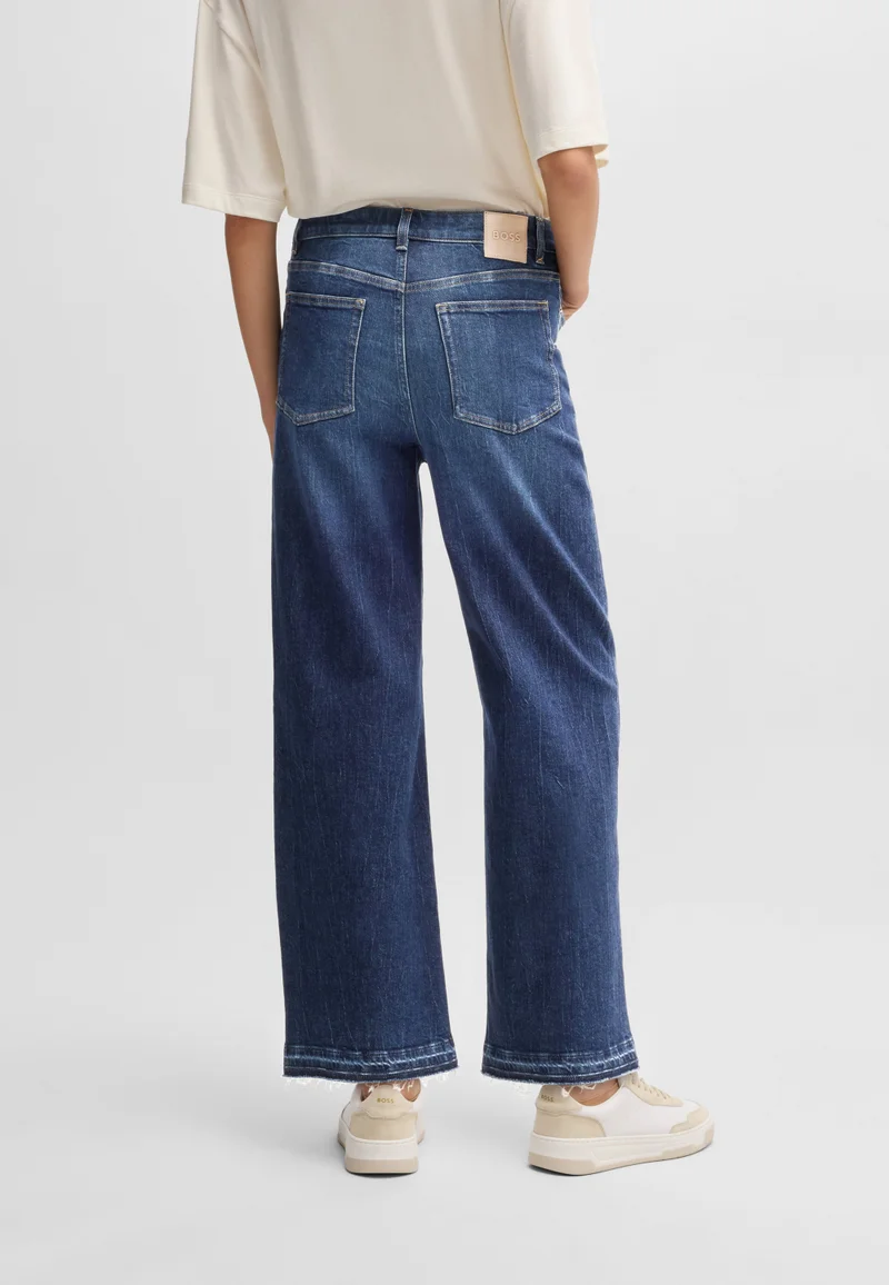 بوس جينز واسع الساق من دينم مطاطي بلون نيلي