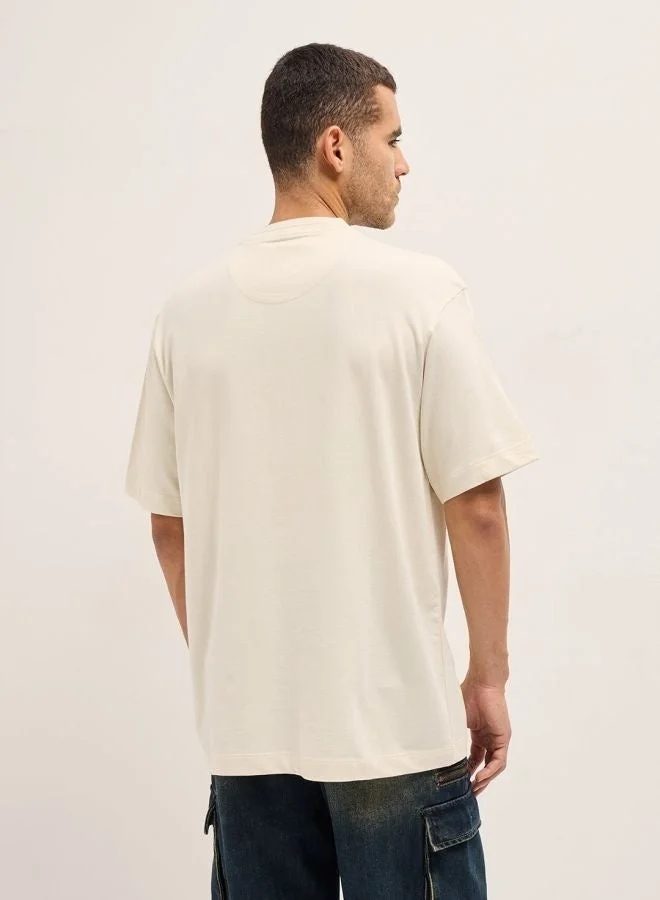 THE BEAR HOUSE  Men's Cream Pixelated Smiley Face Oversize Crew Neck T-shirt Perfect For Casual Wear, Gym, Travel, Or Layering Stylish And Versatile Essential For Every Wardrobe for Men | Best Price UAE