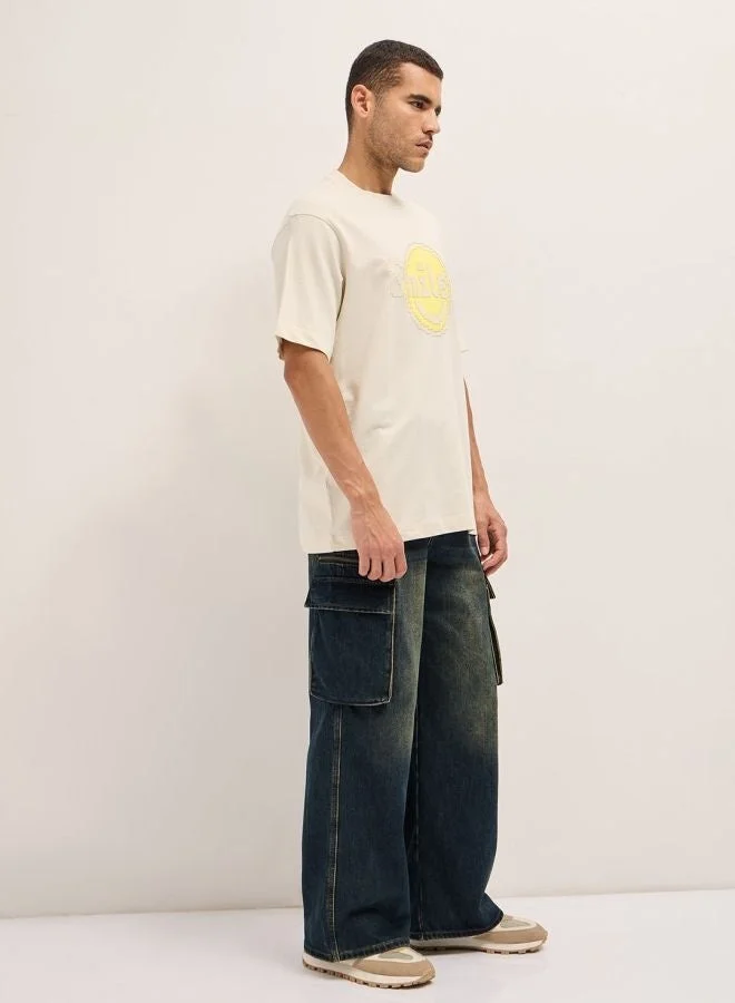 THE BEAR HOUSE  Men's Cream Pixelated Smiley Face Oversize Crew Neck T-shirt Perfect For Casual Wear, Gym, Travel, Or Layering Stylish And Versatile Essential For Every Wardrobe for Men | Best Price UAE