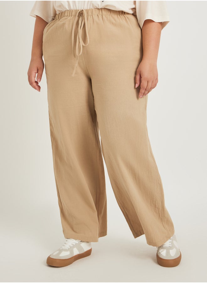 Styli Plus Size Solid Wide Leg Pants with Drawstring Waist  - Image 2