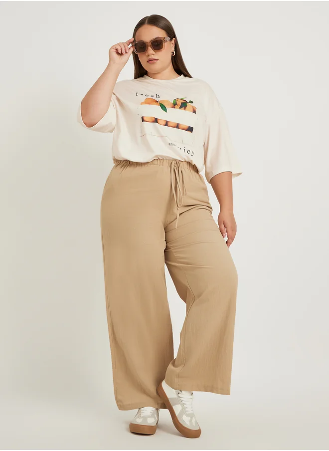 Styli Plus Size Solid Wide Leg Pants with Drawstring Waist