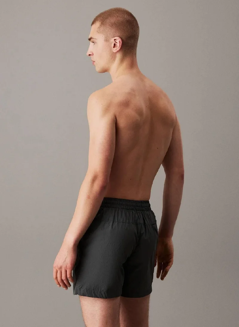 كالفن كلاين جينز شورت سباحة بخصر مزدوج من نايلون ناعم سي كيه