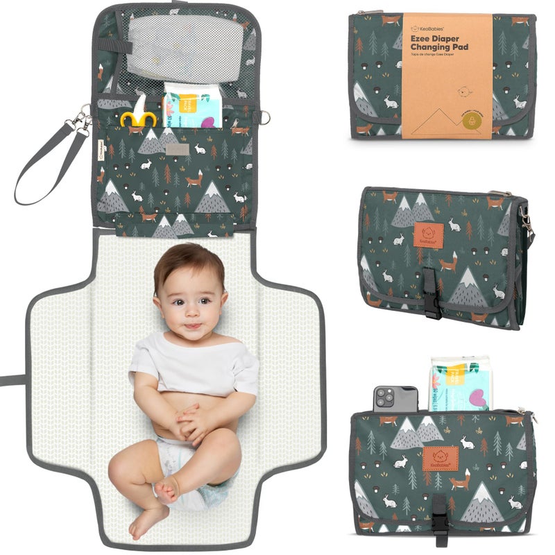 KeaBabies Portable Diaper Changing Pad - Large Waterproof Baby Changing Mat, Compact Travel Diaper Clutch, Functional Pockets Fit Newborn Essentials, Wipeable & Padded Baby Changer (Woods) - Image 1