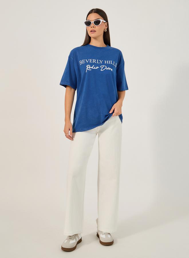 ستايلي تيشيرت بطباعة واسع بياقة دائرية وأكمام قصيرة - Image 2