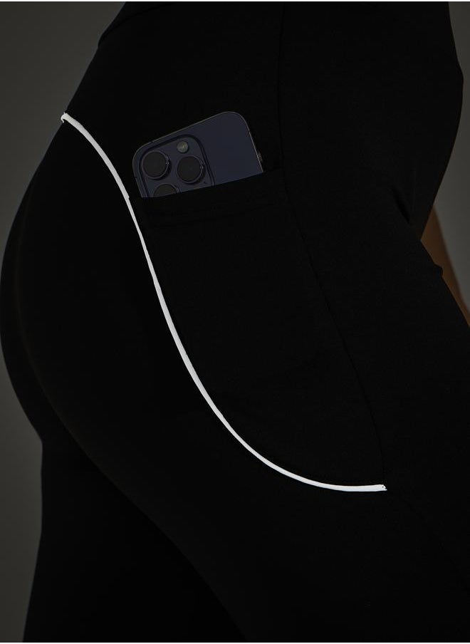 Single Reflective Strip Pocket Detail Flared Leggings - pzsku/ZEAEA6C1037C4FAC76A37Z/45/_/1730198113/7cdaa032-fbbf-462e-93dd-f72596fafd41