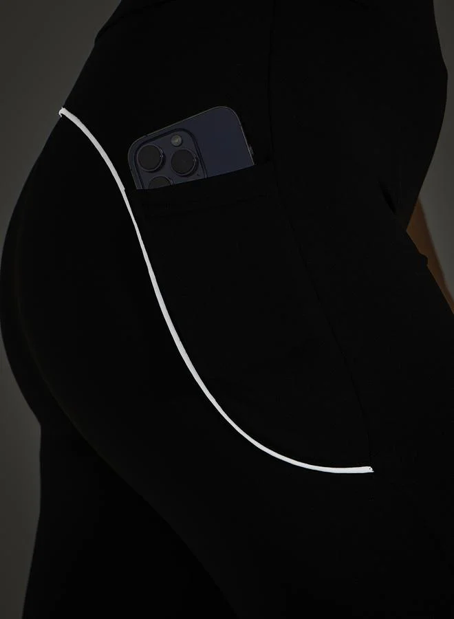 Styli Single Reflective Strip Pocket Detail Flared Leggings